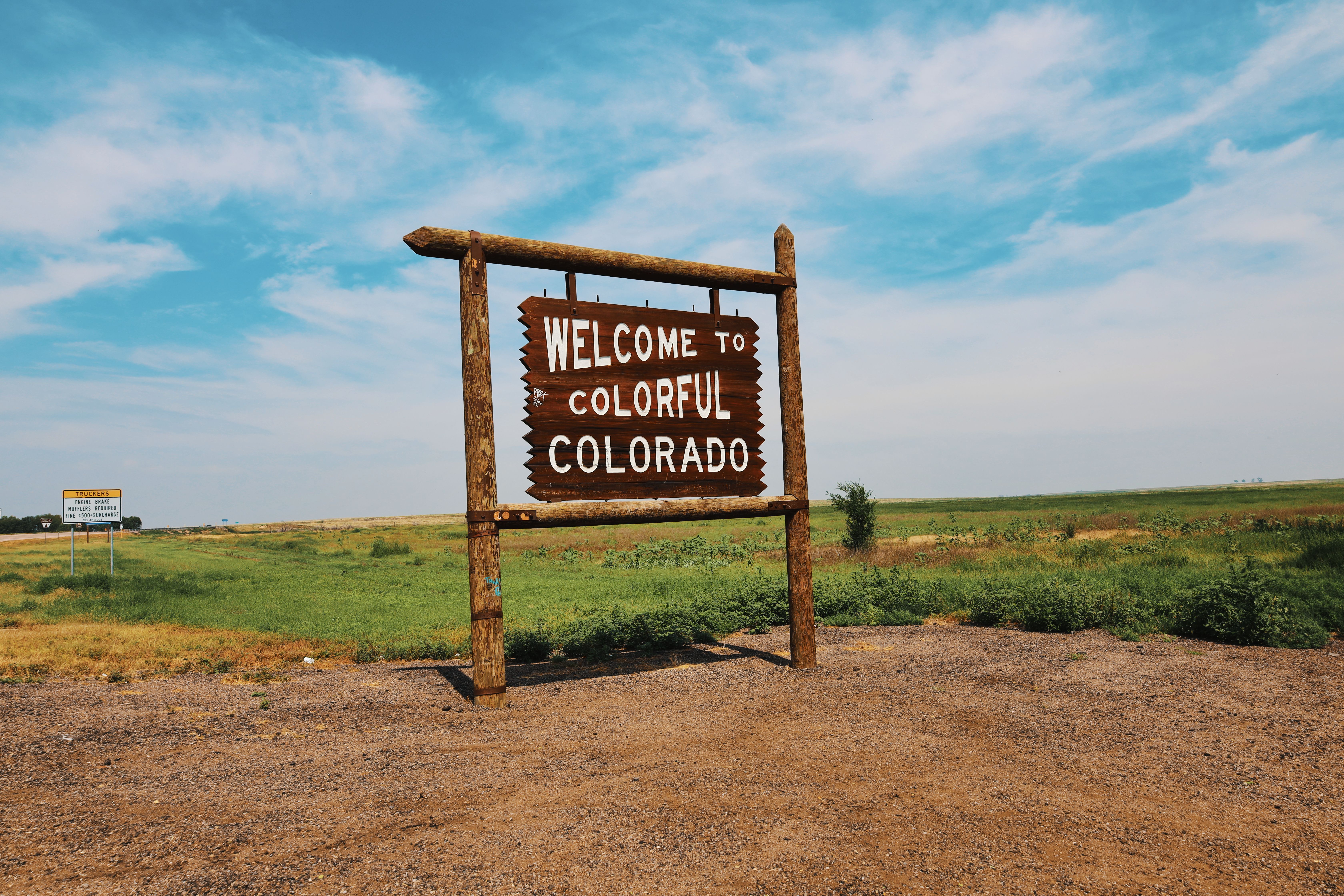 Welcome to Colorful Colorado sign at the state line on the eastern plains